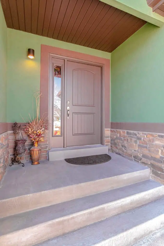 Cherry Brown Front Door Color for Green House