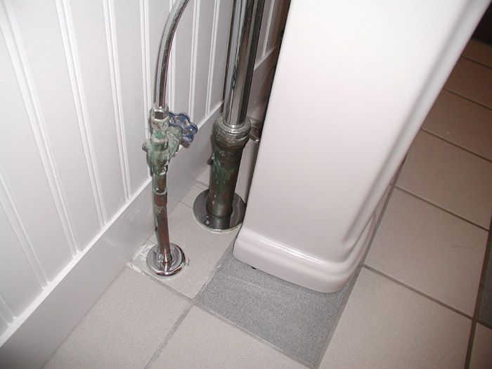 How to install a pedestal sink with floor plumbing