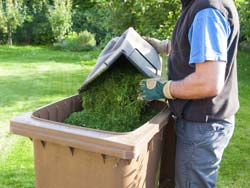 Put Grass Clippings in Waste Containers