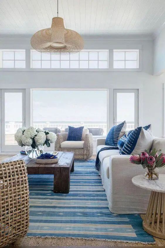 Coastal Living Room with Layered Rugs