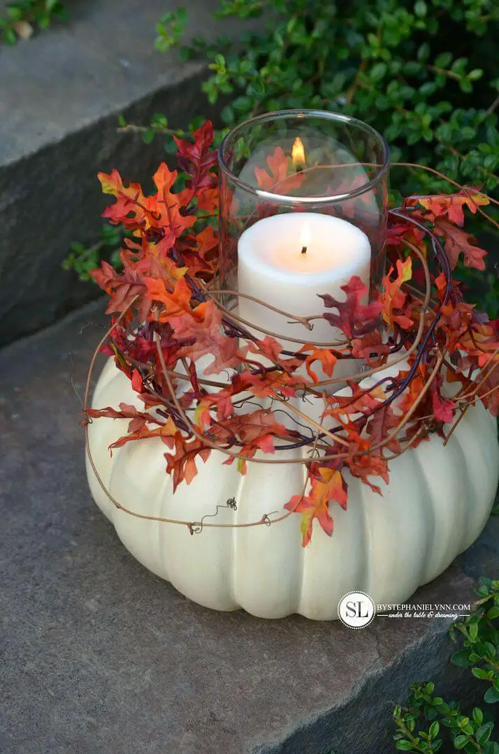 Painted pumpkins as candle holders