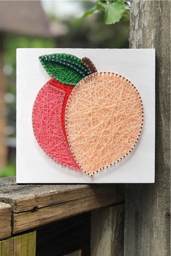 nail and string peach sign