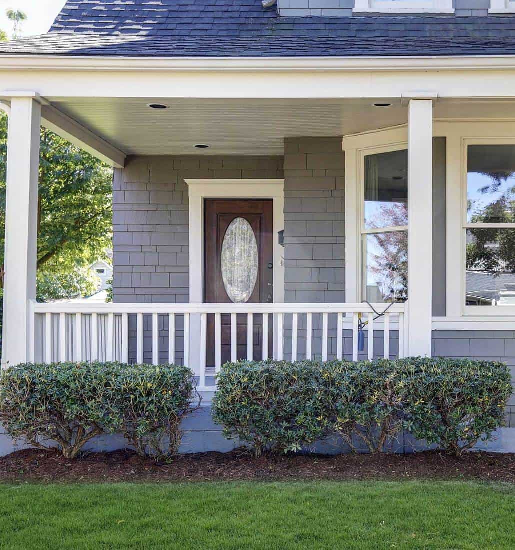 Hardwood front door for gray house