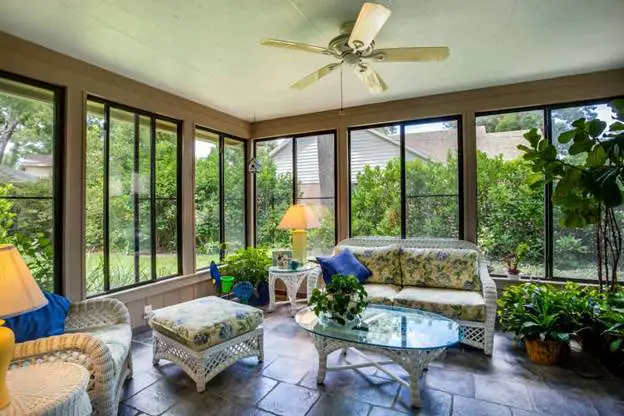 Charming Enclosed Patio with Floral Touch