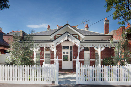 White front door for red brick house