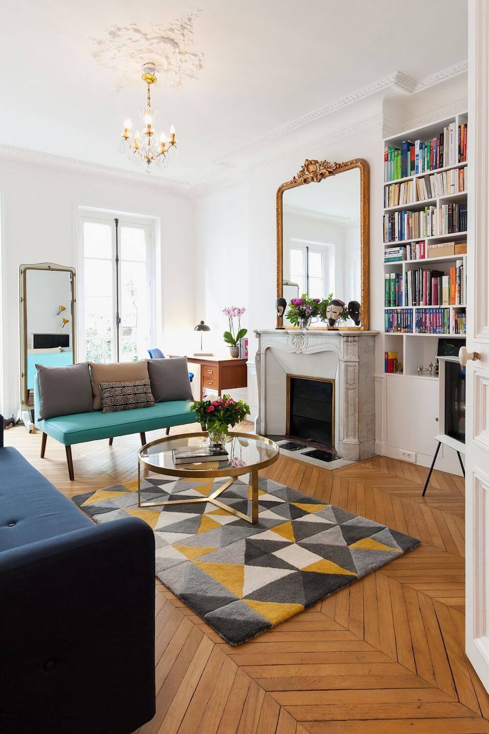Parisian living room with mid century modern rug and furniture