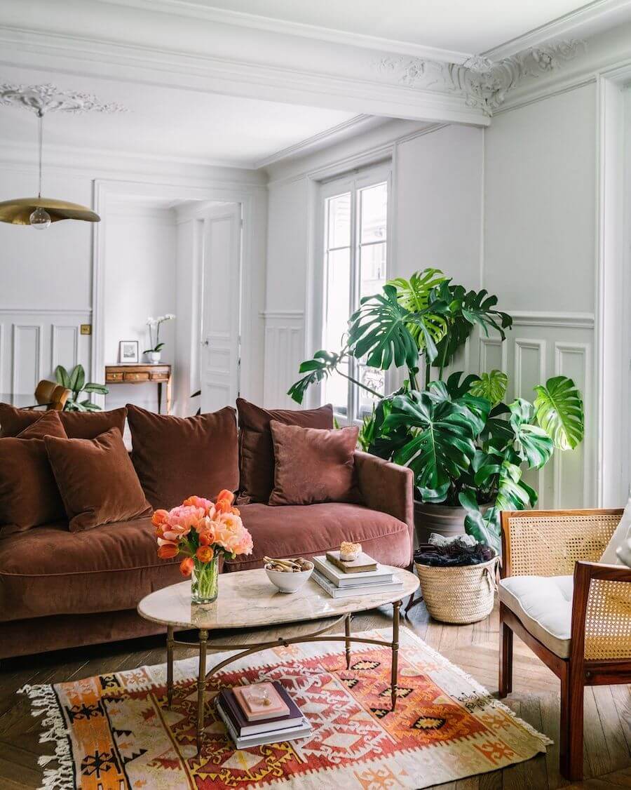 Parisian living room with velvet burgundy sofa