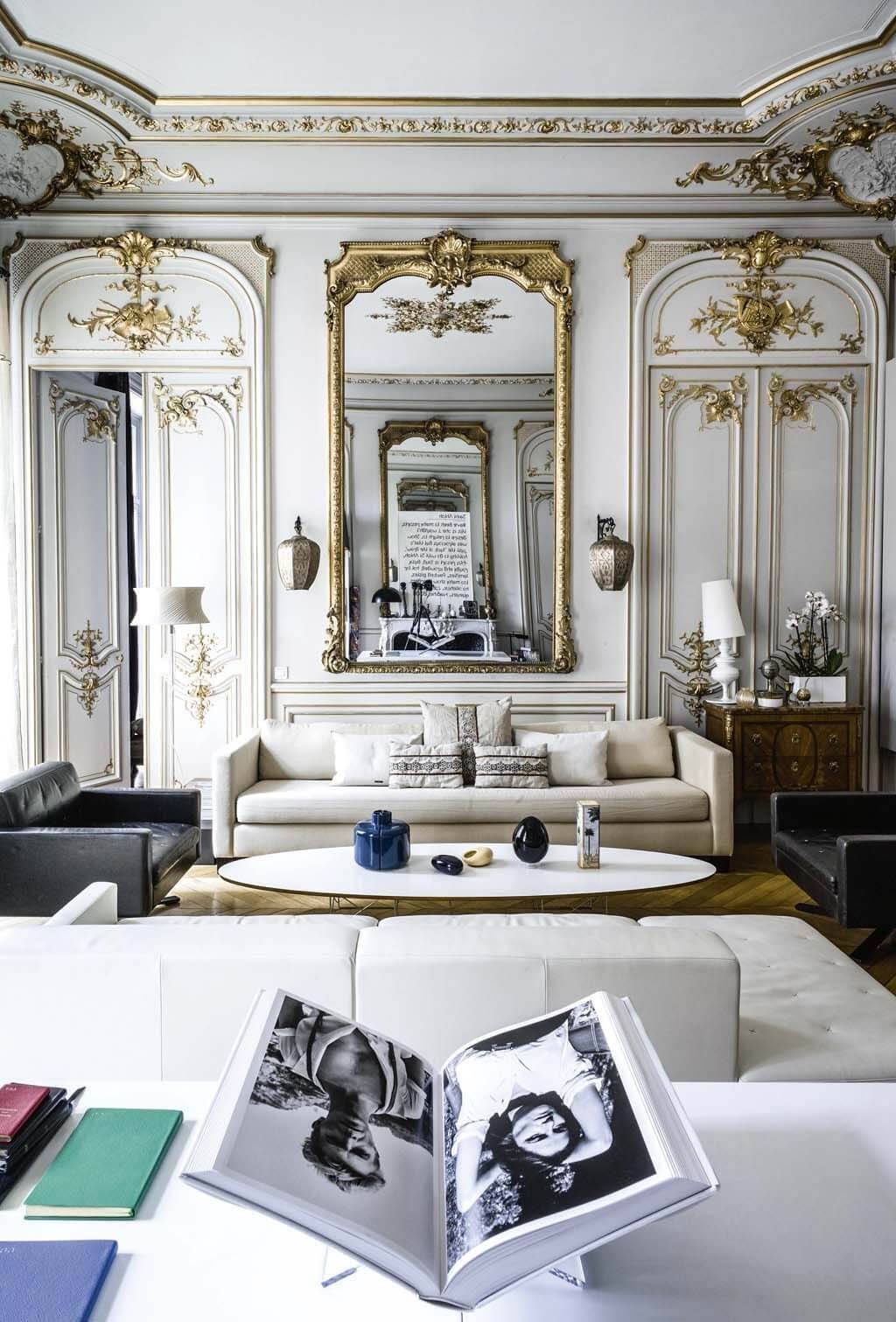 Parisian living room with gold moulding on the wall