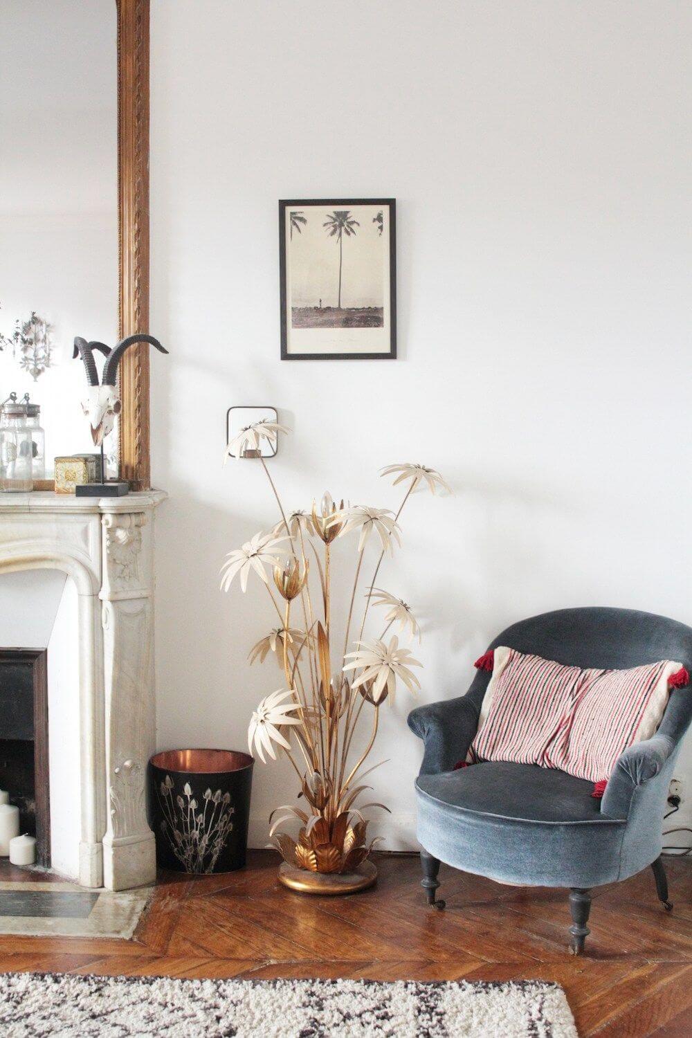 Parisian living room with blue velvet accent chair