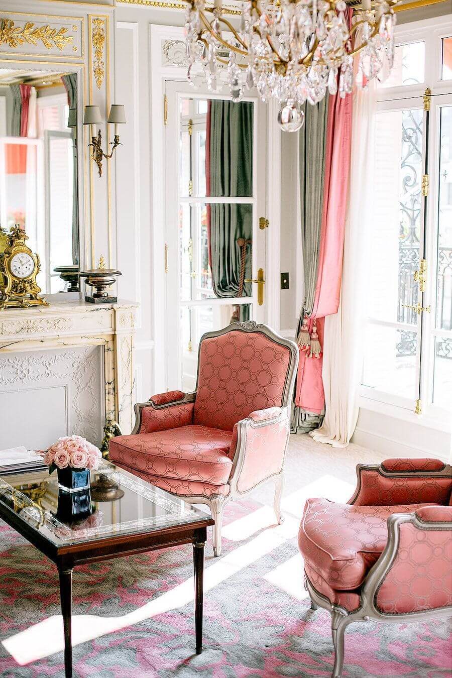 Parisian living room with pink Louis fauteuil accent chairs