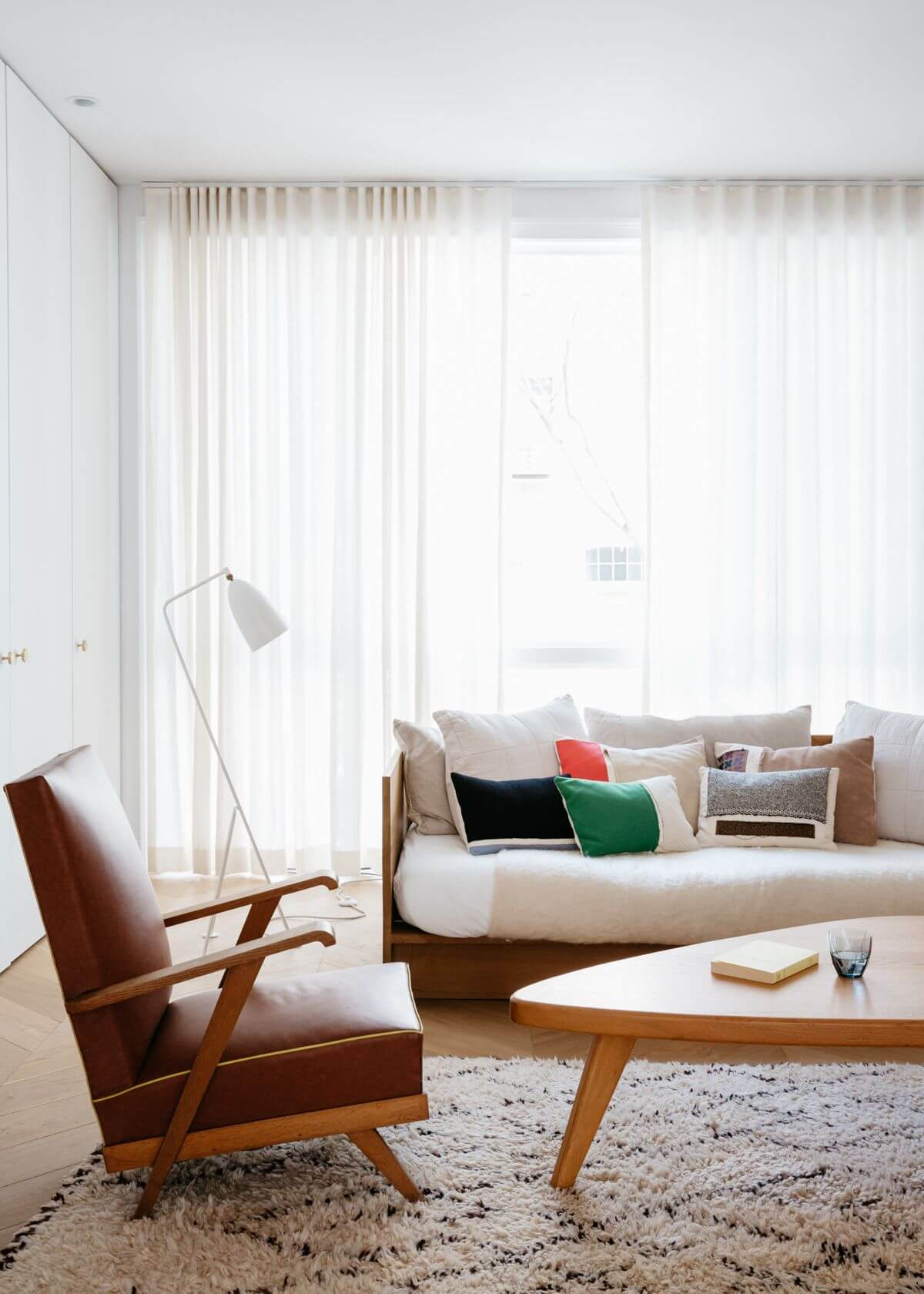 Mid Century Modern Living Room Decor with Brown Leather Accent Chair