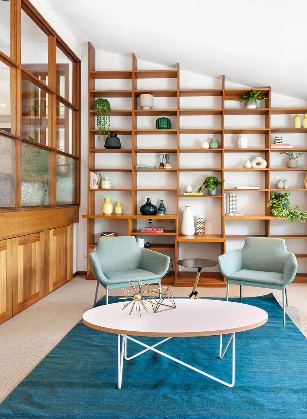 Mid Century Modern Living Room with Built in Wood Bookshelves
