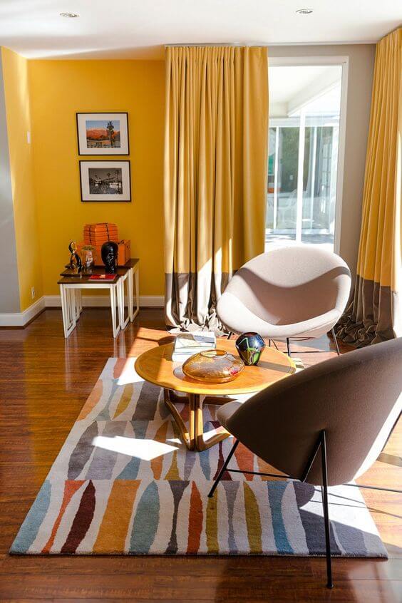 Mid Century Modern Living Room with Yellow Walls and Geometric Rug