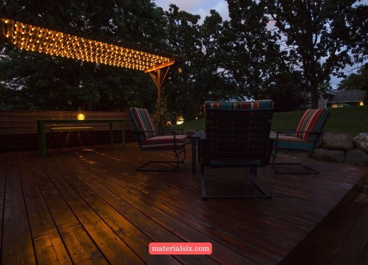 Outdoor deck with pergola enhanced by stylish lighting