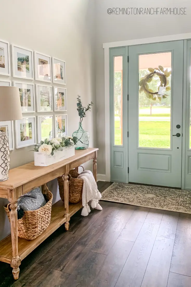 Entryway table complemented by a stylish gallery wall above