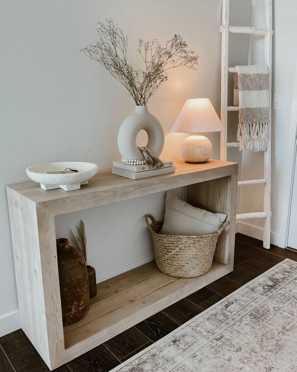 Entryway table featuring a decorative ceramic bowl for holding keys and small items