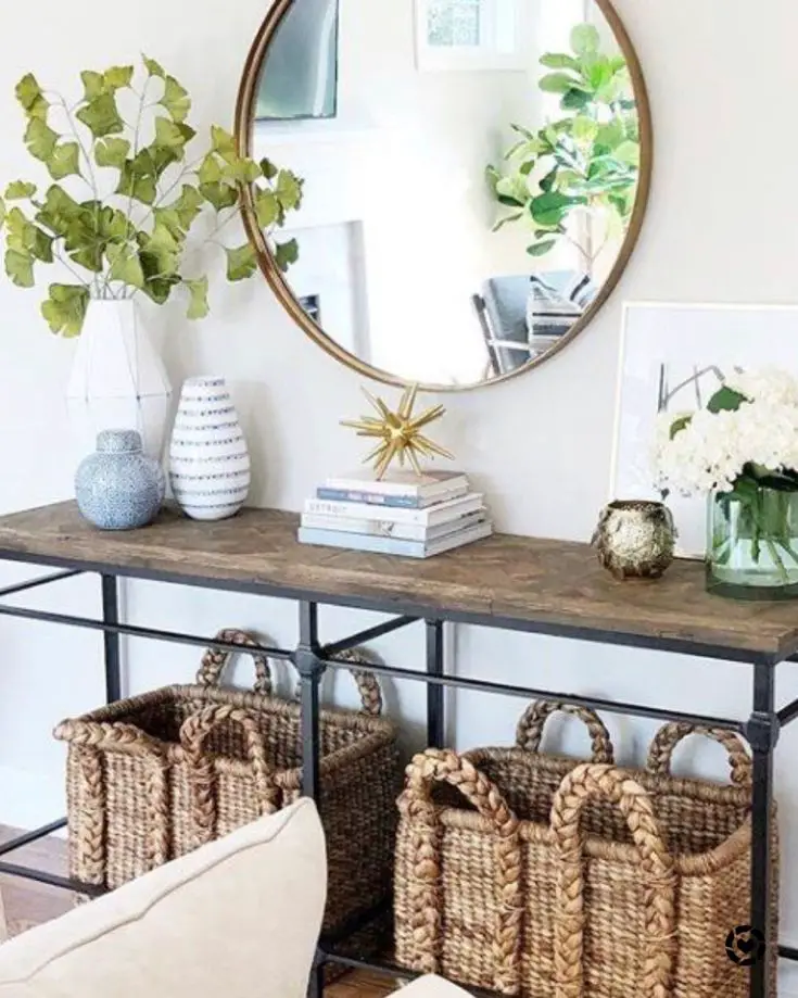 Entryway table featuring wicker baskets underneath for convenient storage
