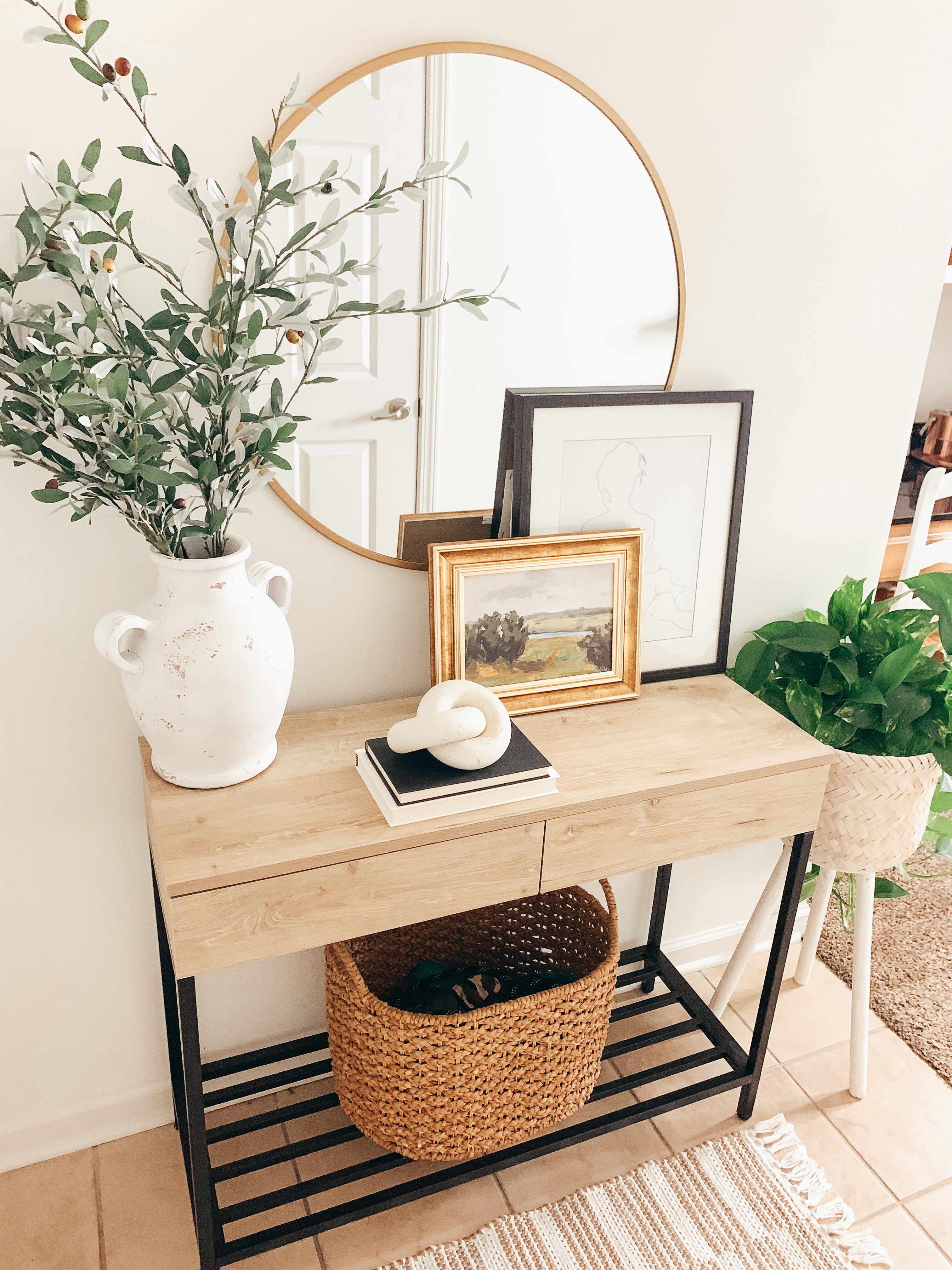 Entryway table equipped with a modern mail organizer for sorting mail and documents