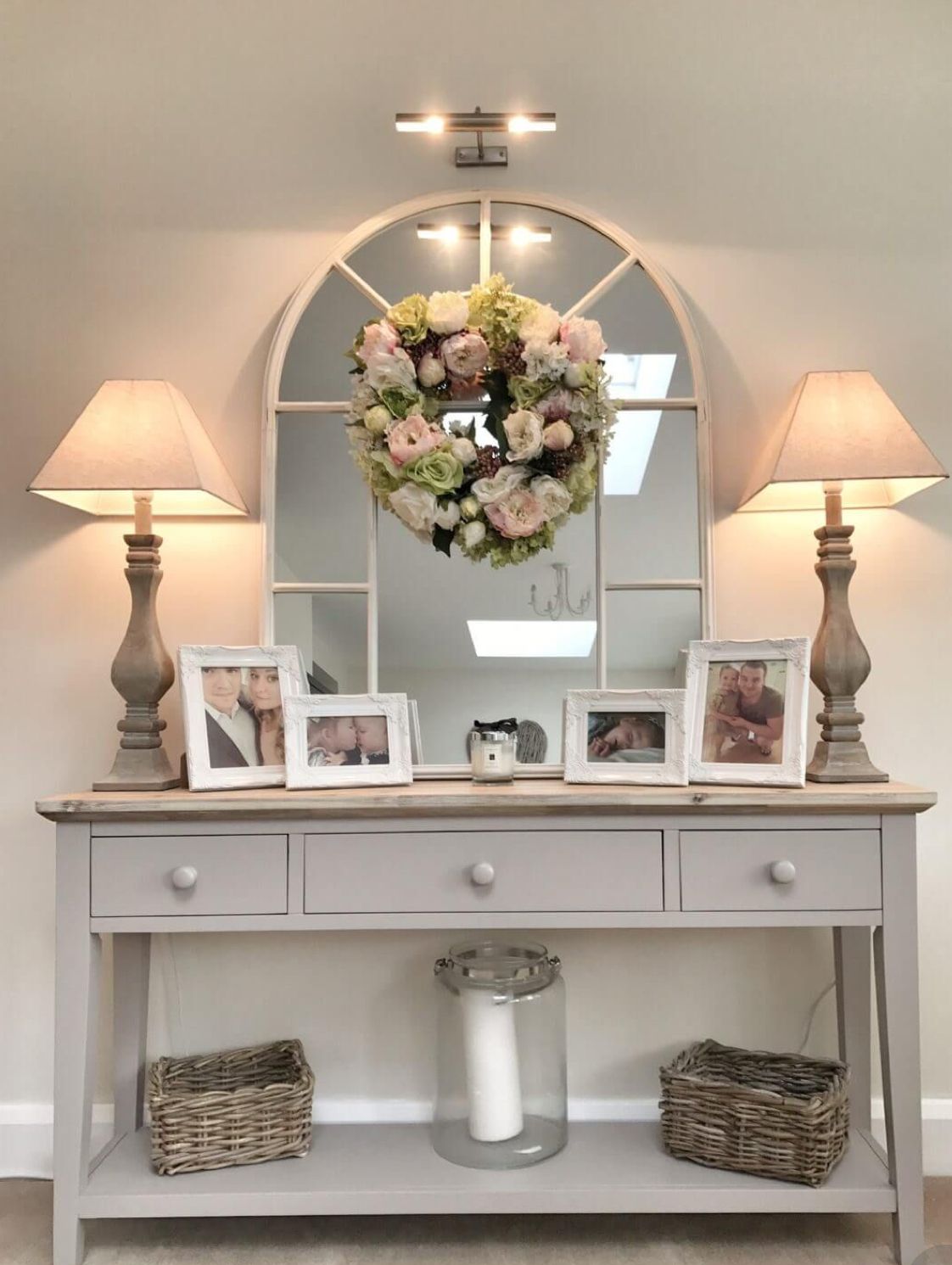 Entryway table adorned with a beautiful floral centerpiece as a focal point