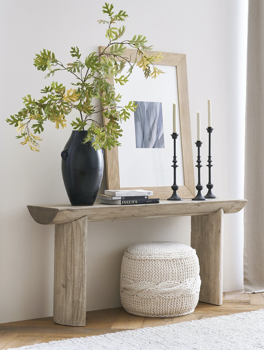 Entryway table decorated with artistic ceramic vases for a touch of elegance
