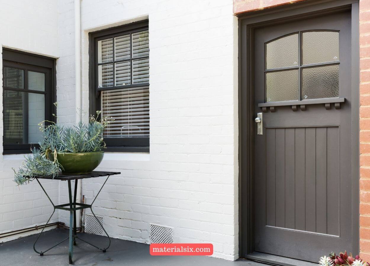 Sophisticated charcoal-colored front door for a modern and stylish entrance