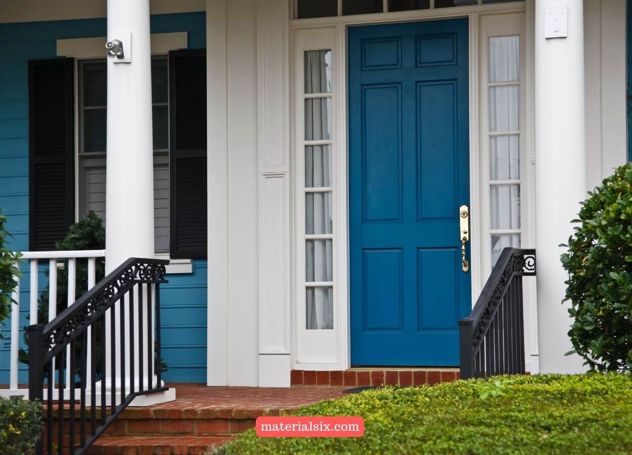 Eye-catching teal front door adding a pop of color to the home exterior