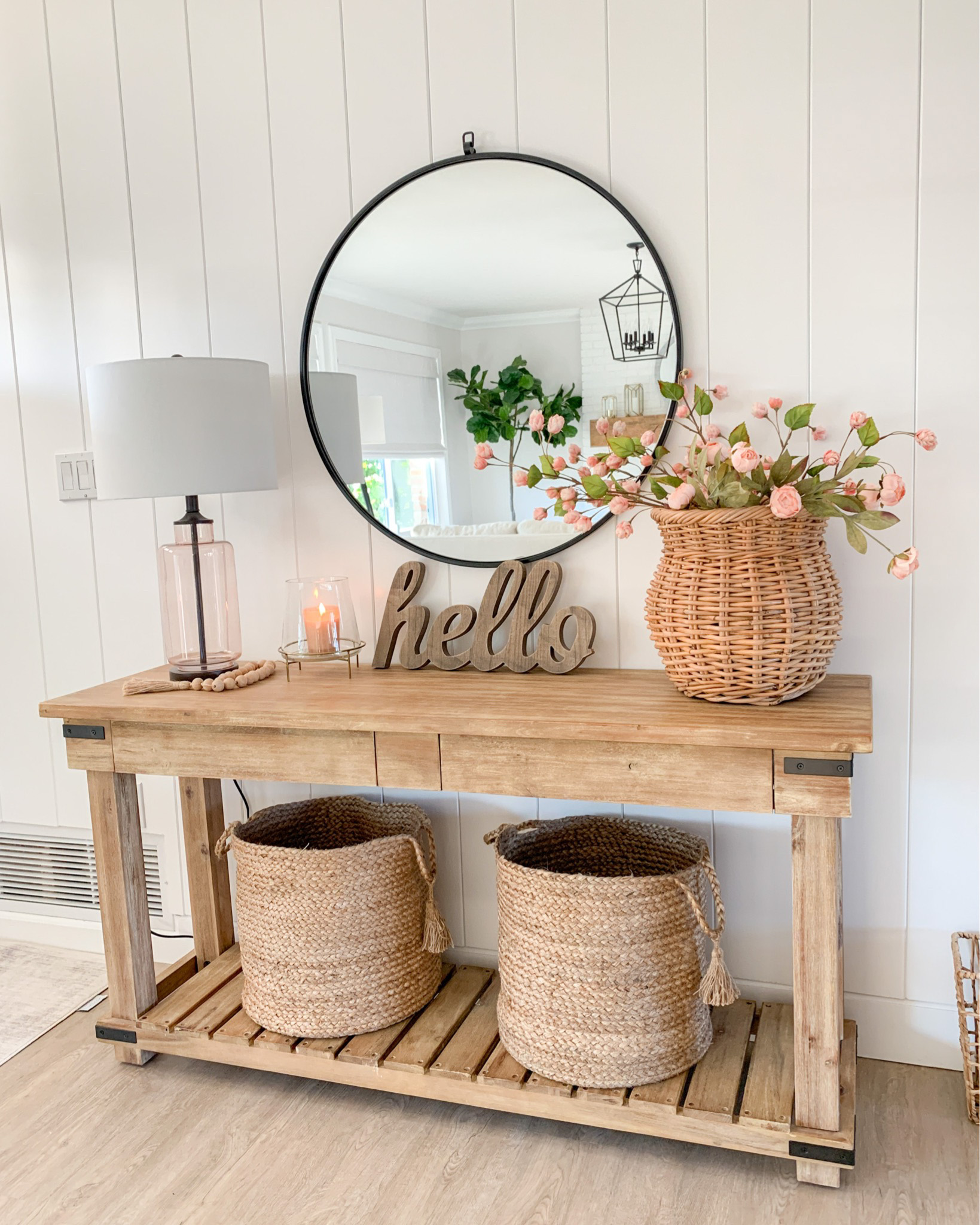 Entryway table adorned with a decorative vase filled with fresh flowers