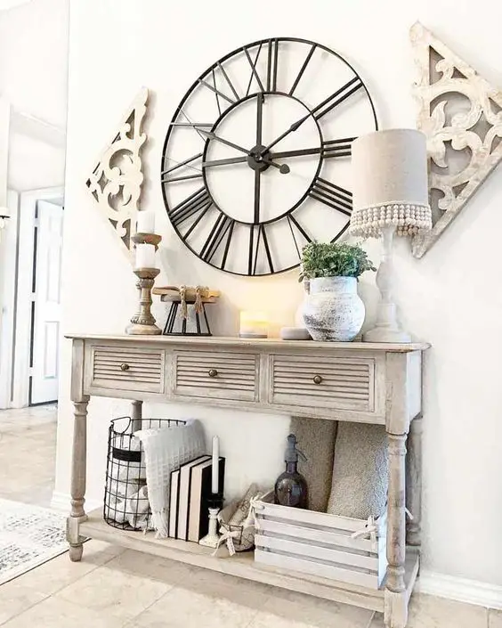 Entryway table accompanied by a decorative wall clock as a functional and stylish element