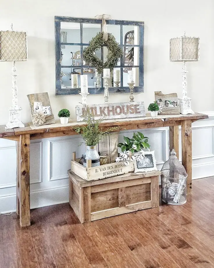 Rustic entryway table  dorned with farmhouse decor for a cozy welcome