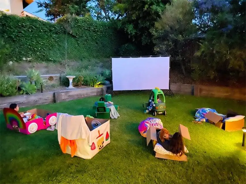 Kids outside watching a movie