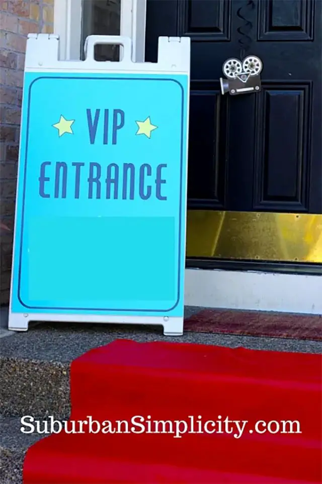 A sign that says "VIP Entrance" by a front door
