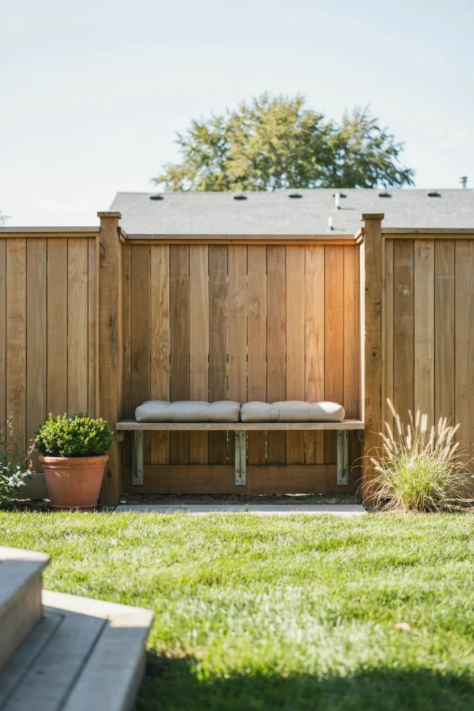 Space-saving good neighbor fence setup featuring a seating area and outdoor privacy ideas