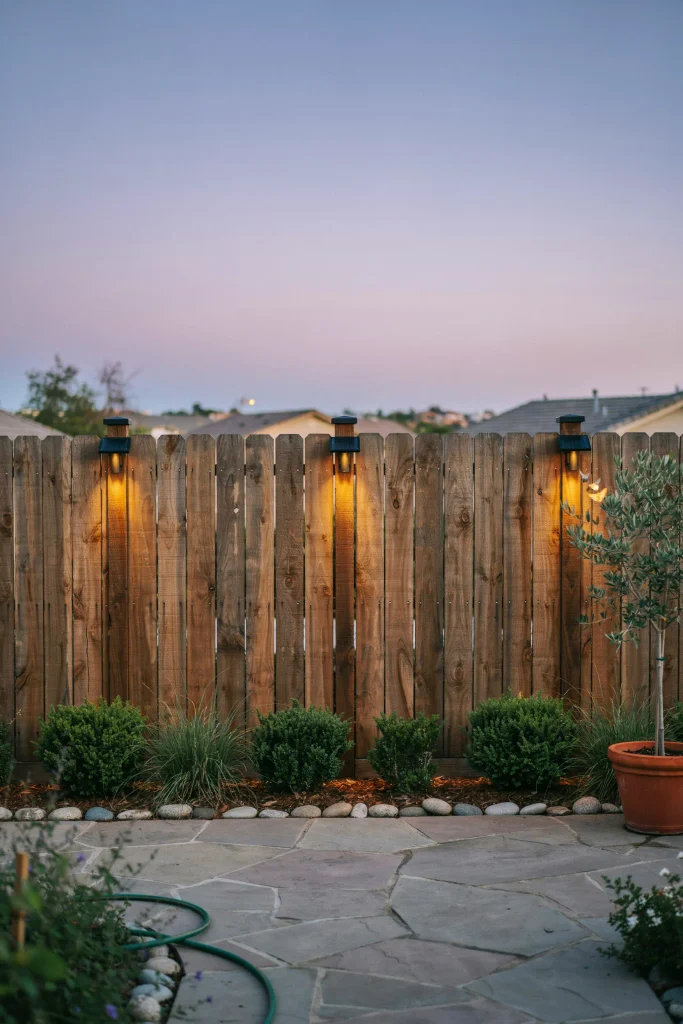 Eco-friendly privacy fence ideas accented with glowing solar-powered LED lights