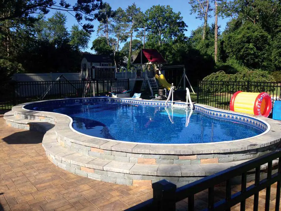 20 Stunning Semi-Inground Pool Designs for Your Backyard Oasis (You Won't Believe #8!) - 12. Rustic Stone Retreat